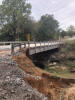 A small bridge crossing over a creek